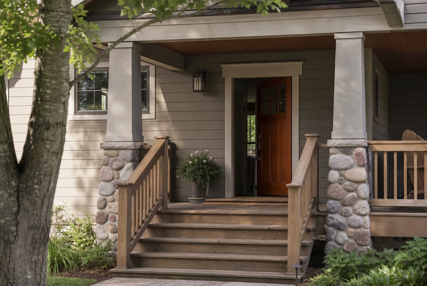 Front porch of a tidy Michigan home in morning light